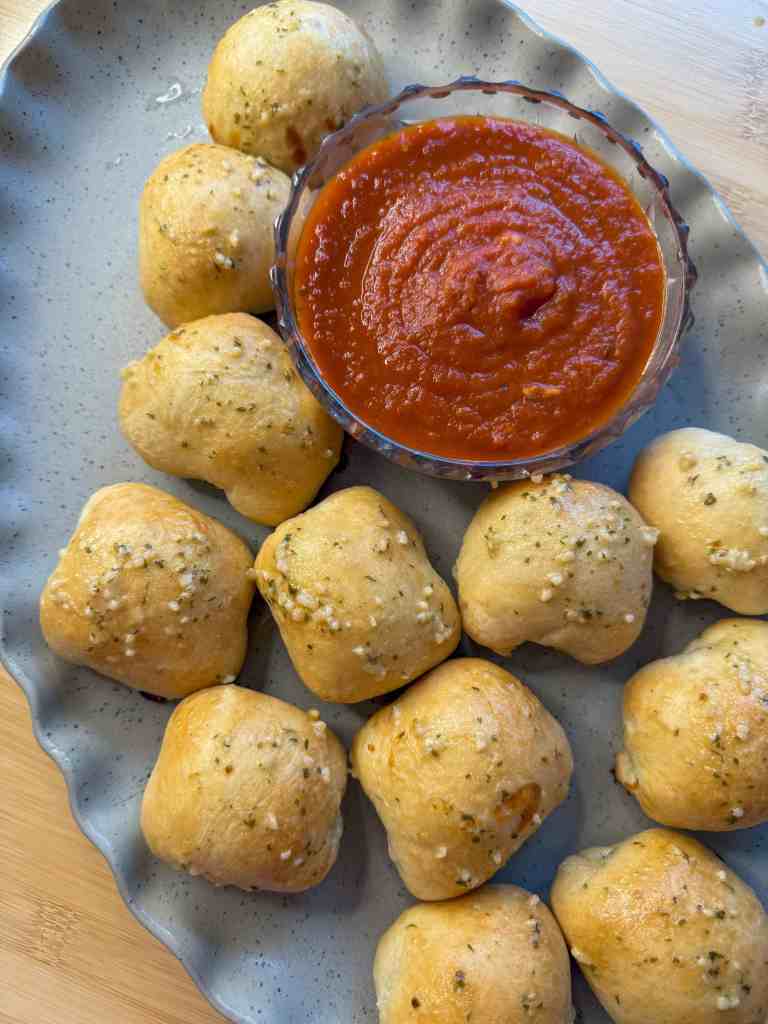 my garlic cheese balls fresh out if the oven arranged on a plate