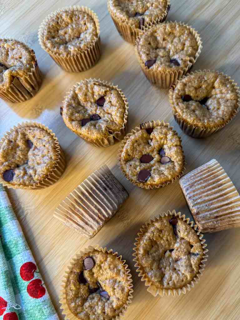 my healthy high protein banana muffins on a wooden table after being baked