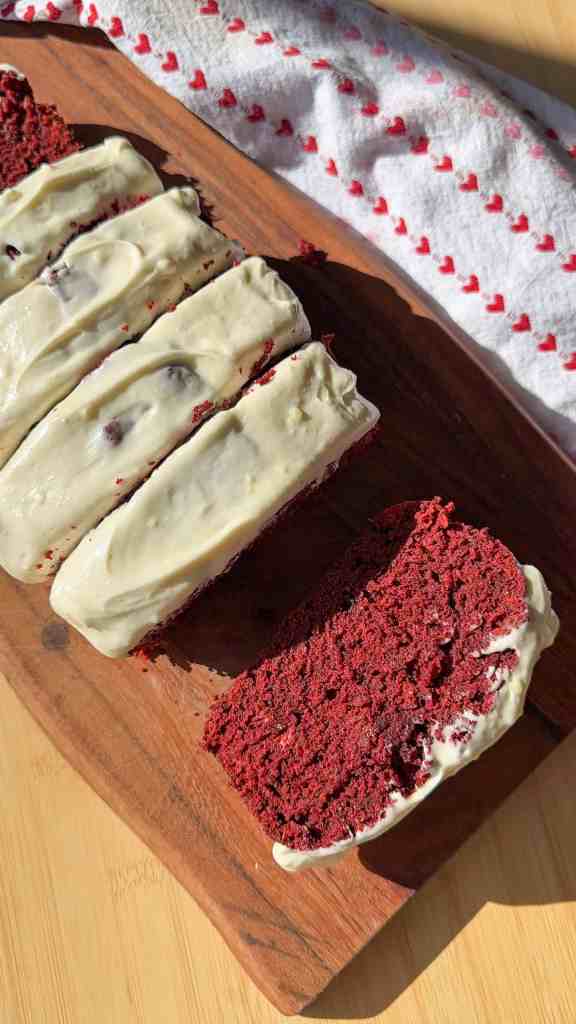 my red velvet banana bread sliced up on a wooden cutting board