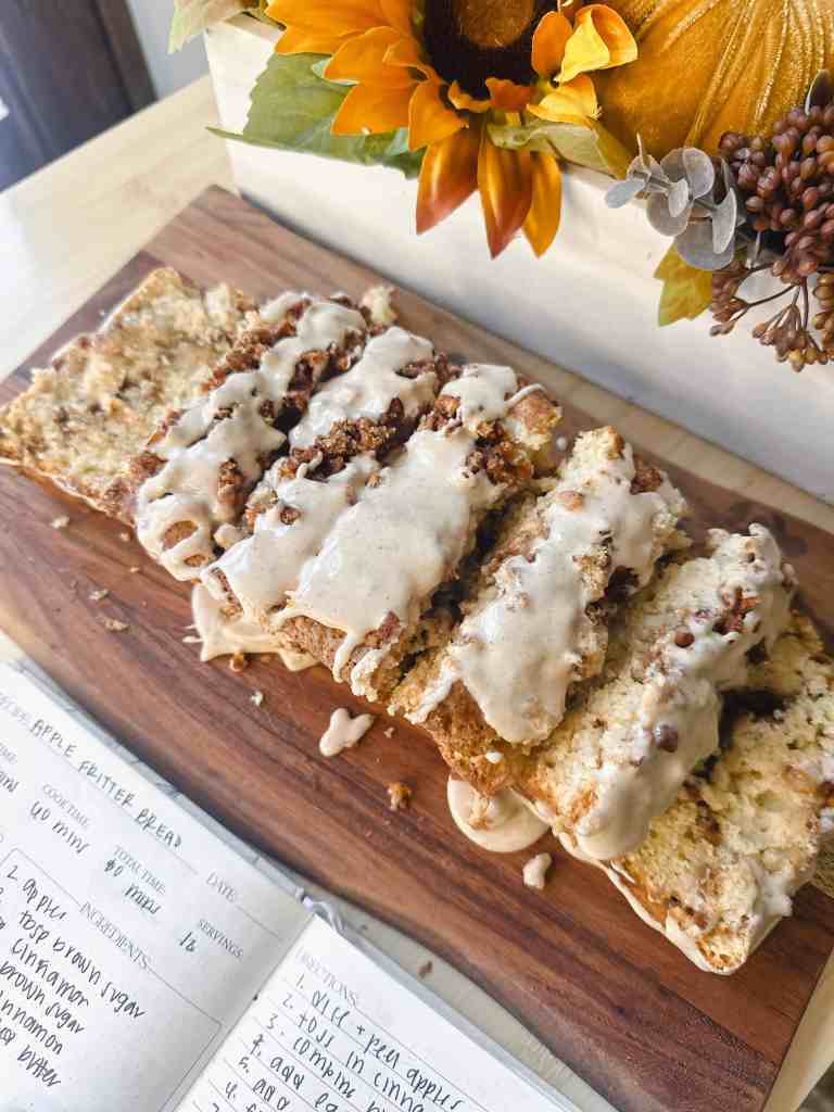 slices of fresh and warm apple fritter loaf with a sweet maple cinnamon glaze. the perfect fall treat