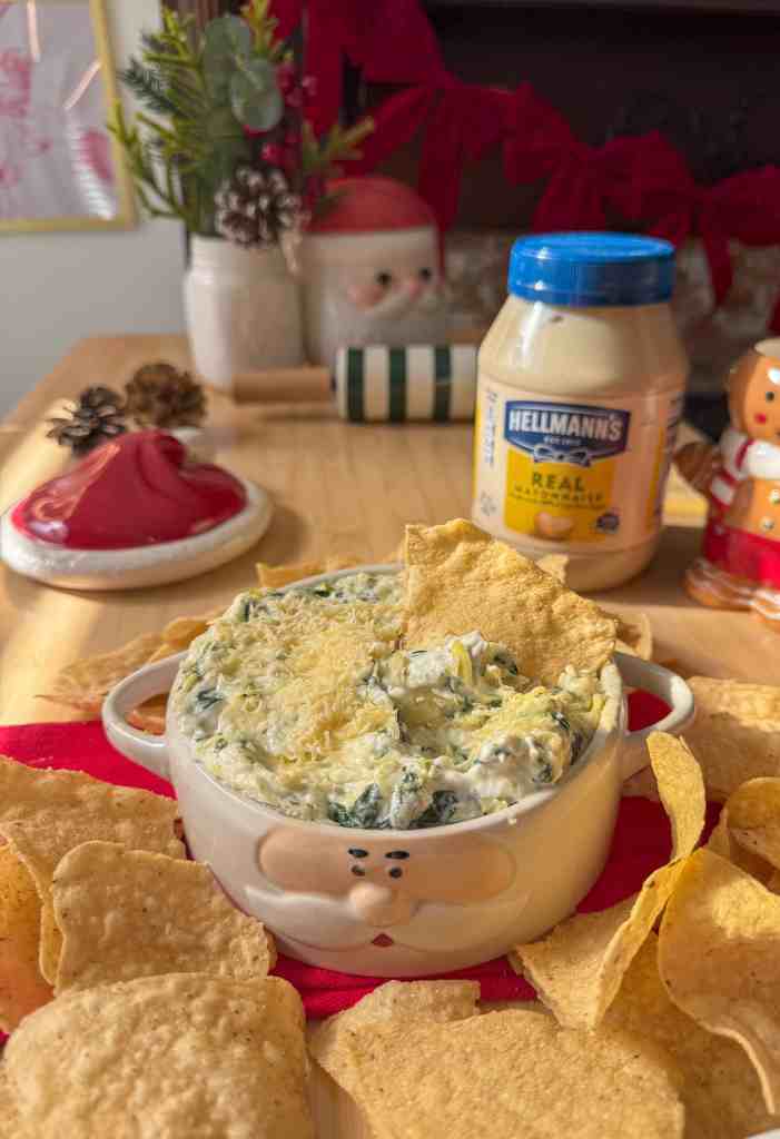 the final image of my gooey spinach and artichoke dip served with tortilla chips