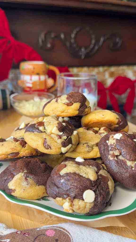 a christmas plate full of my marbled cookies ready to be enjoyed with a glass of milk