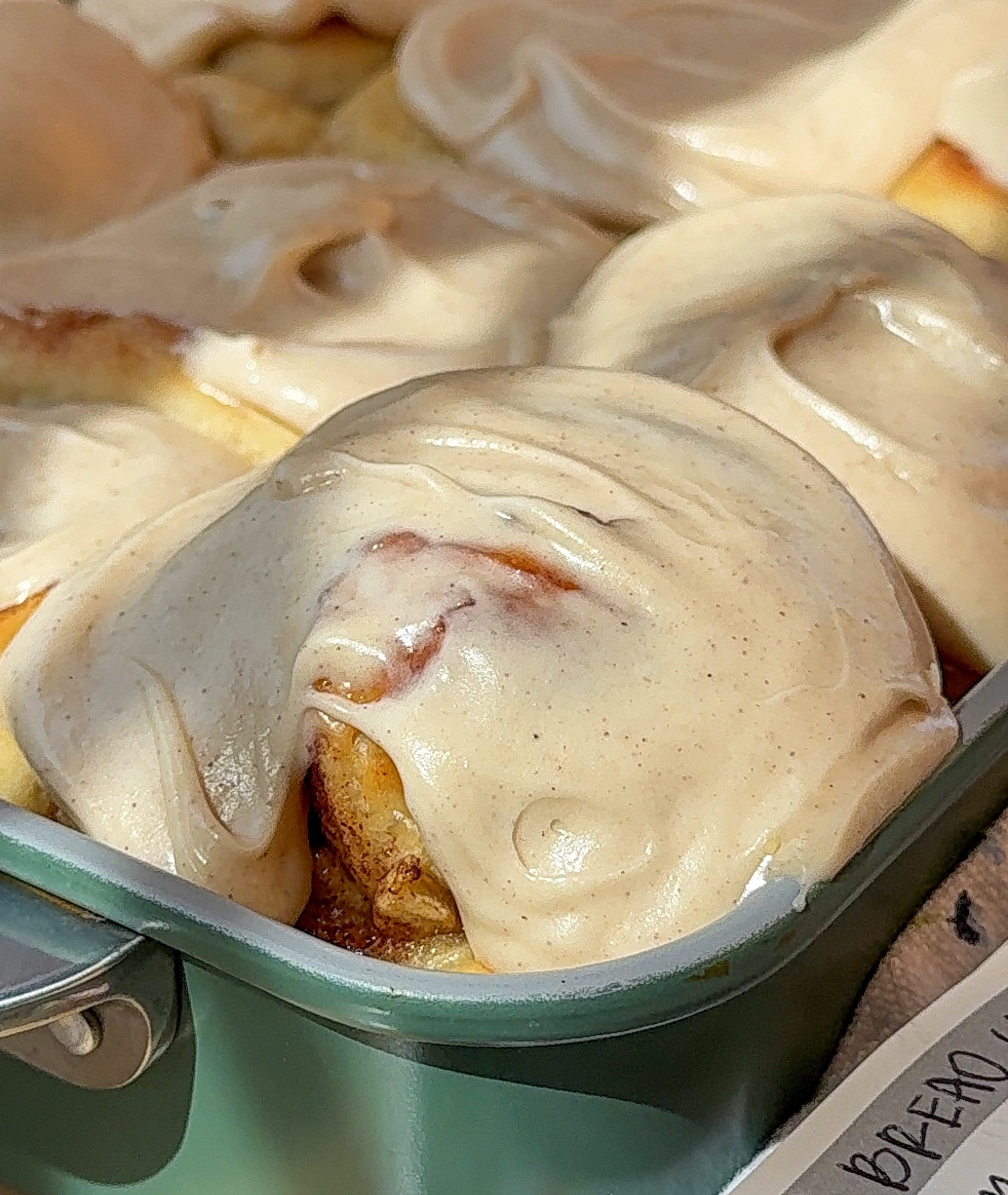 a close up of my banana bread cinnamon rolls in the pan right out of the oven