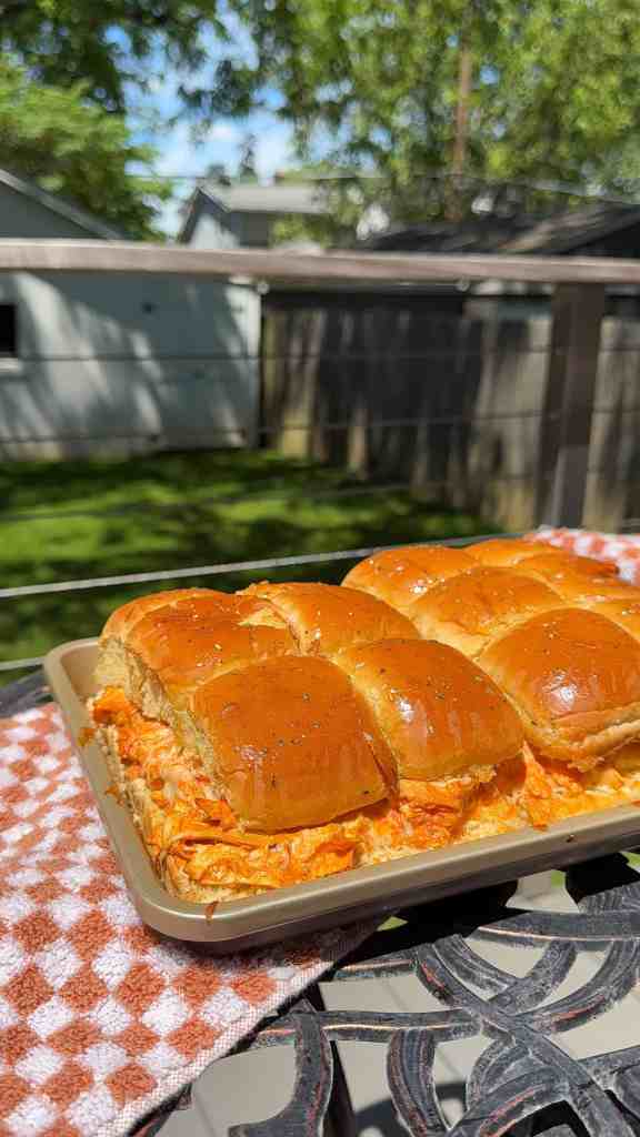a sheetpan full of my buffalo chicken sliders outside for a potluck