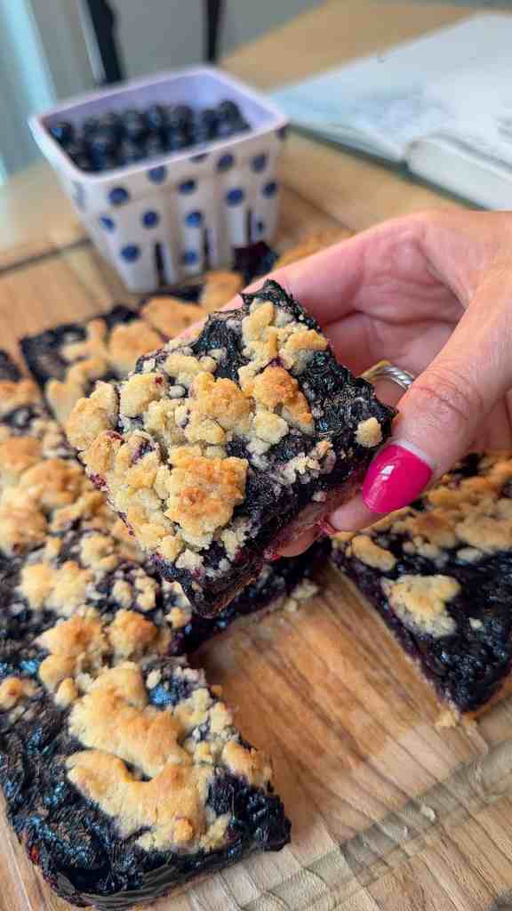 me holding my blueberry pie bars