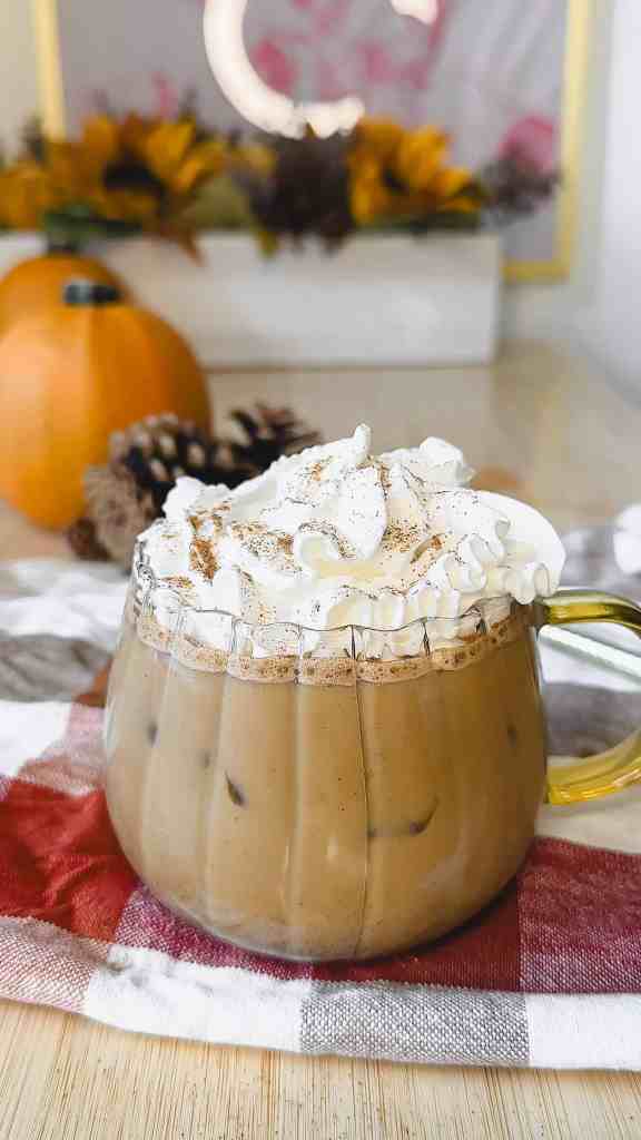 my homemade iced pumpkin spice latte with whipped cream and pumpkin pie spice topping - the perfect cozy fall drink