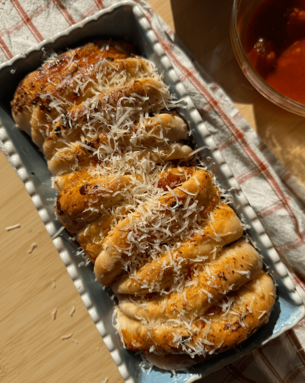 my pepperoni pull apart bread with freshly grated parmesan cheese